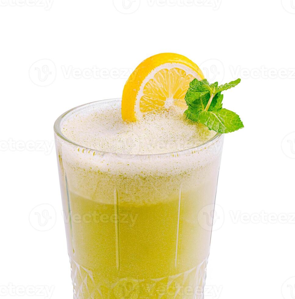 Refreshing lemon and mint beverage served in a glass photo