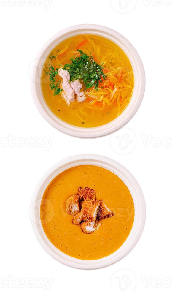 Delicious bowls of soup with vibrant ingredients displayed photo