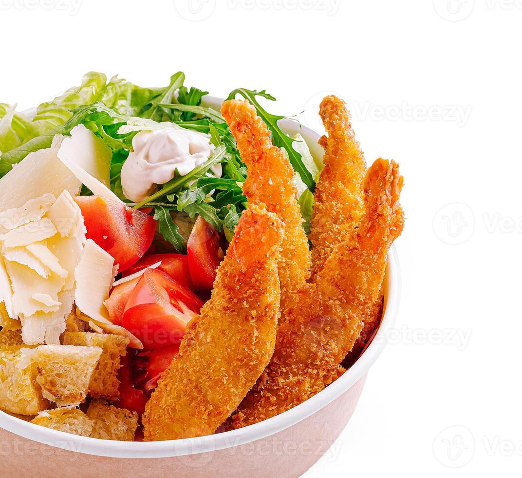 Delicious salad bowl with crispy shrimp and fresh vegetables photo