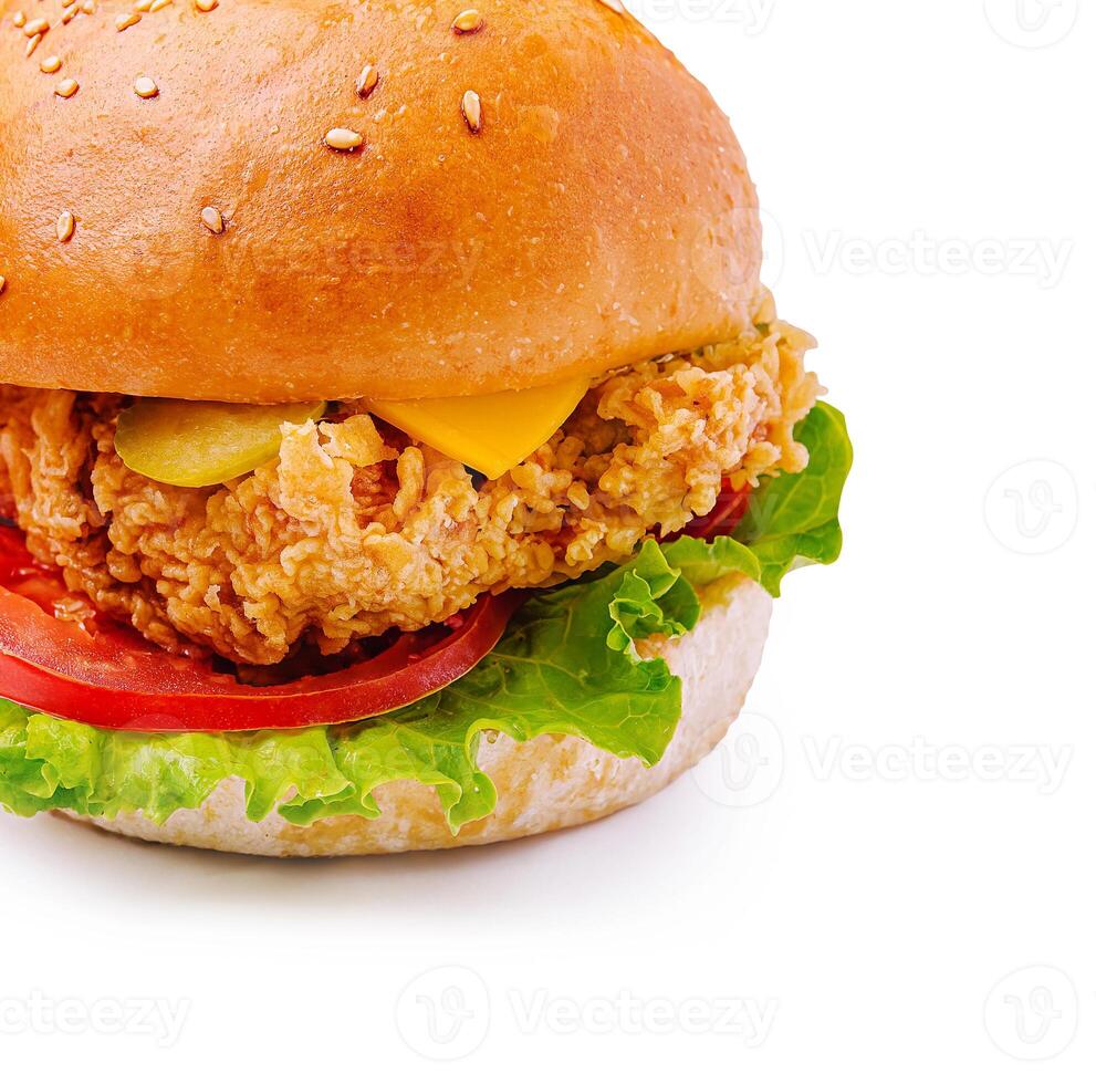 Crispy chicken sandwich with fresh toppings and sesame bun photo
