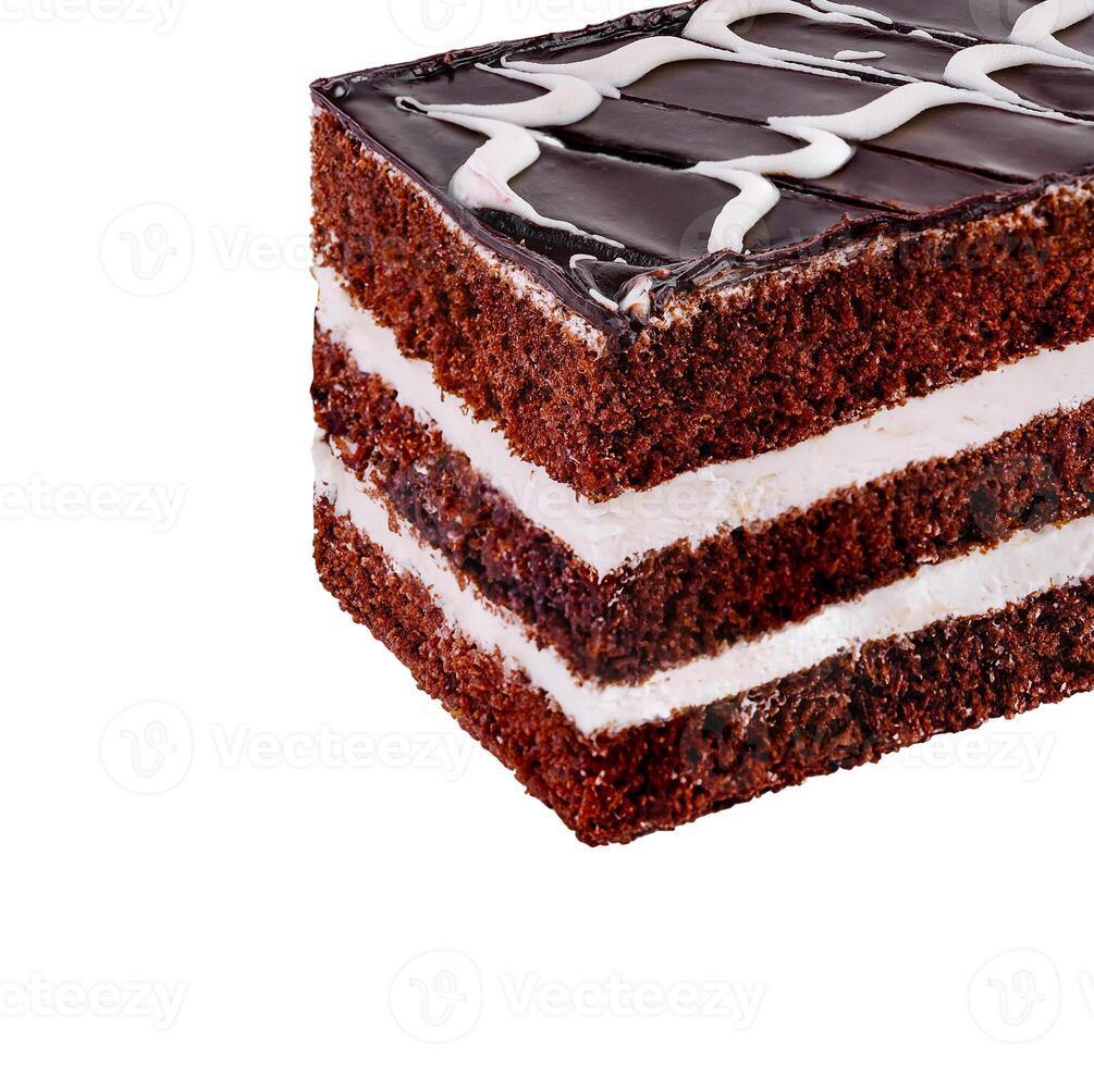 Chocolate cake slice layered with white cream on white photo