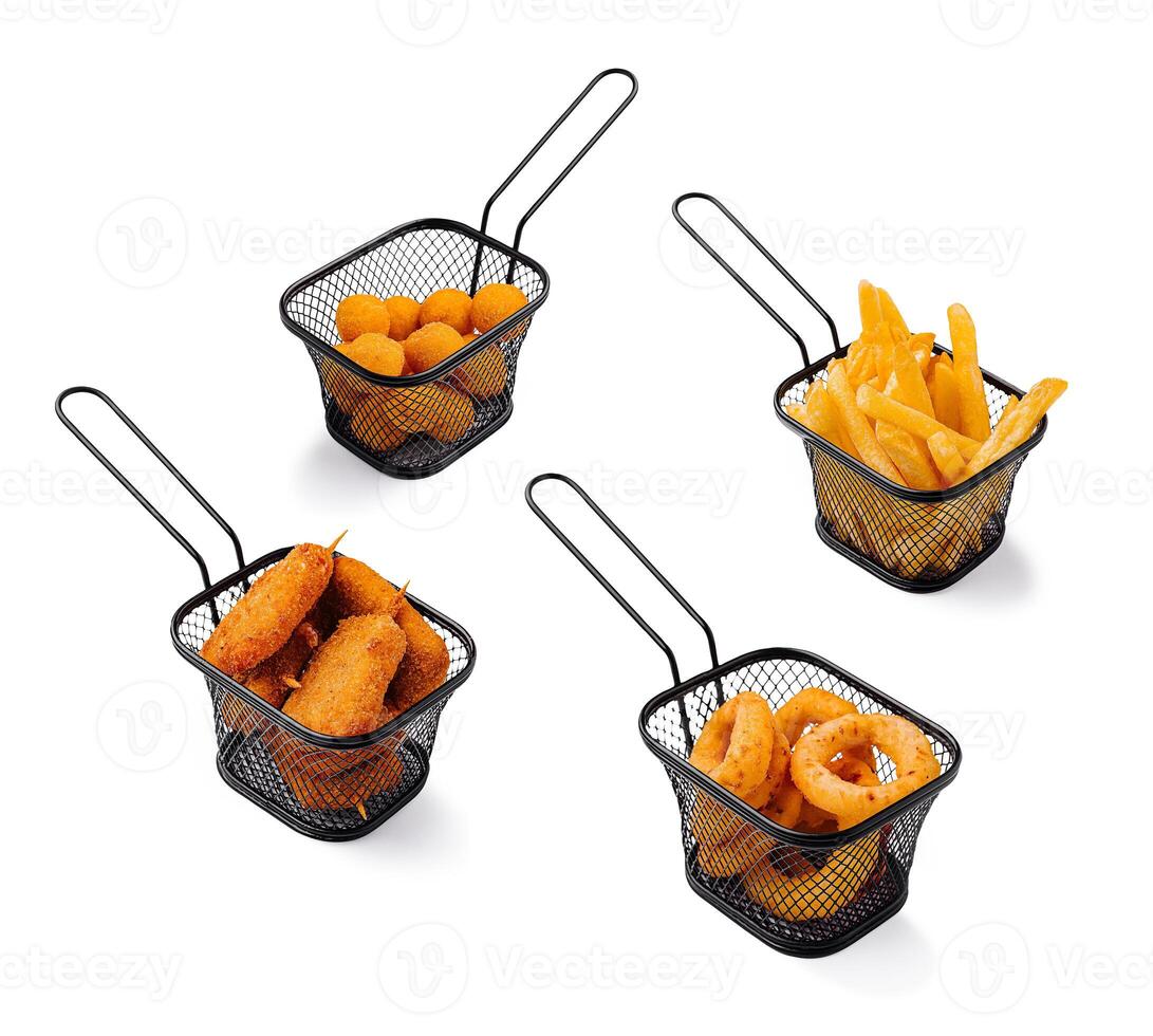 Various fried snacks served in metal baskets at a casual eatery photo