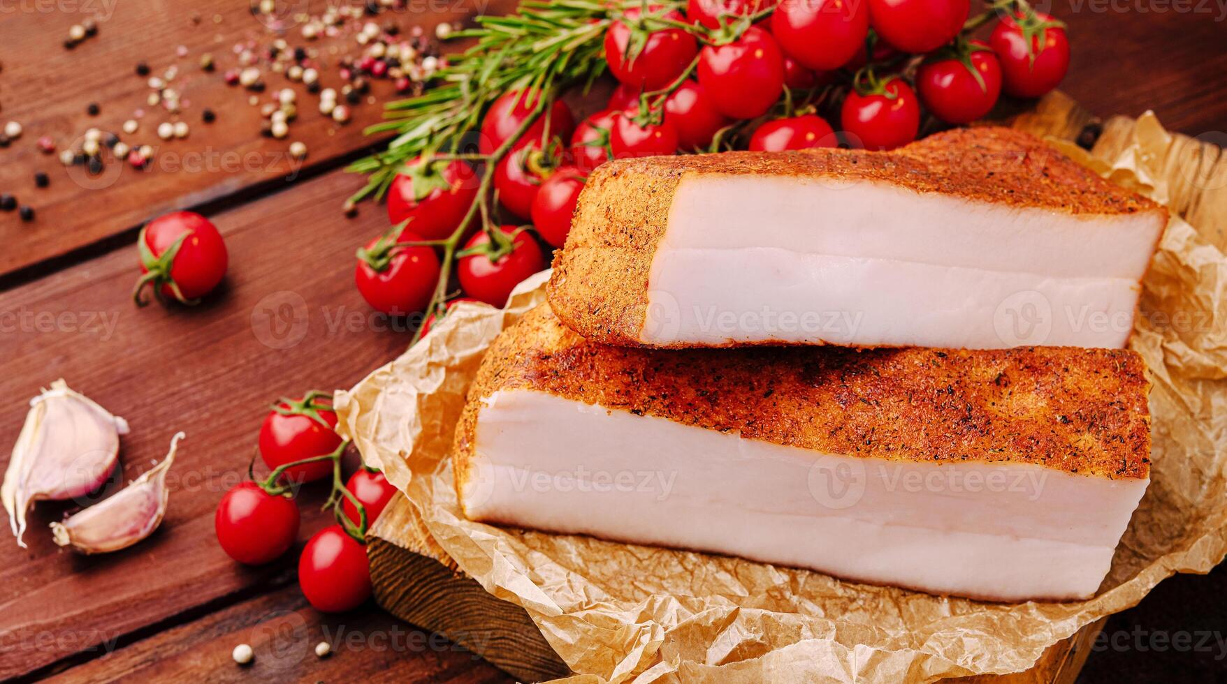 Fresh tomatoes and seasoning with pork belly on wooden table photo