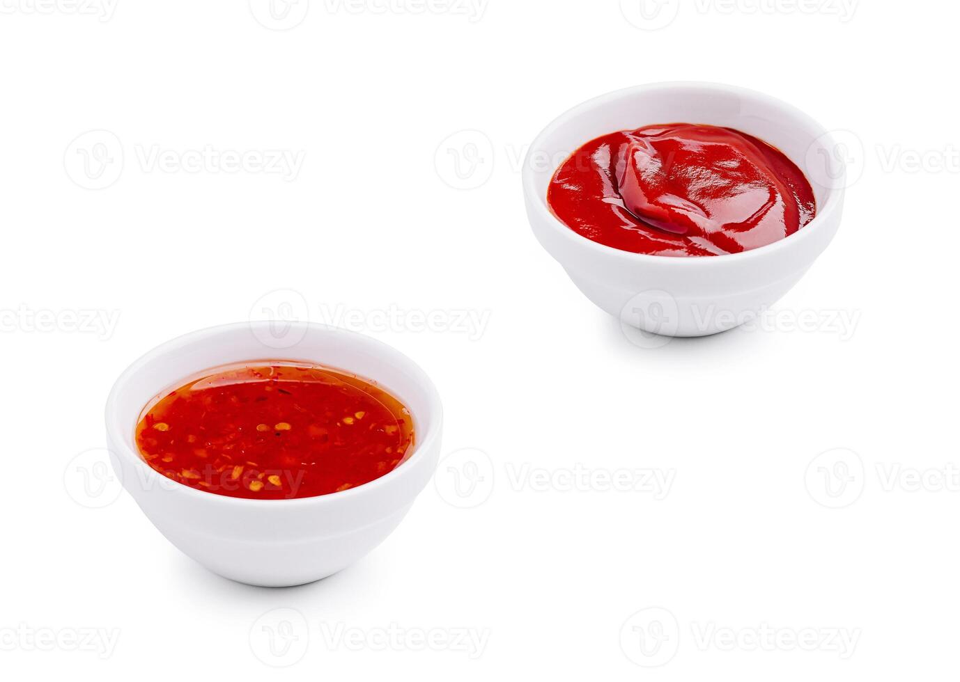 Two small bowls of sauces on a white background ready for dipping photo