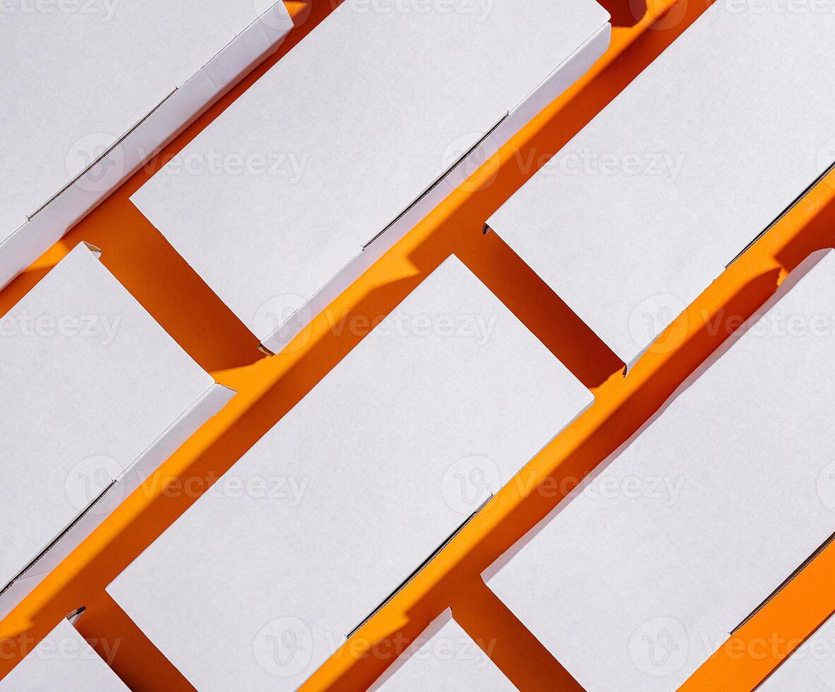 delivery boxes arranged in a dynamic pattern on an orange background photo