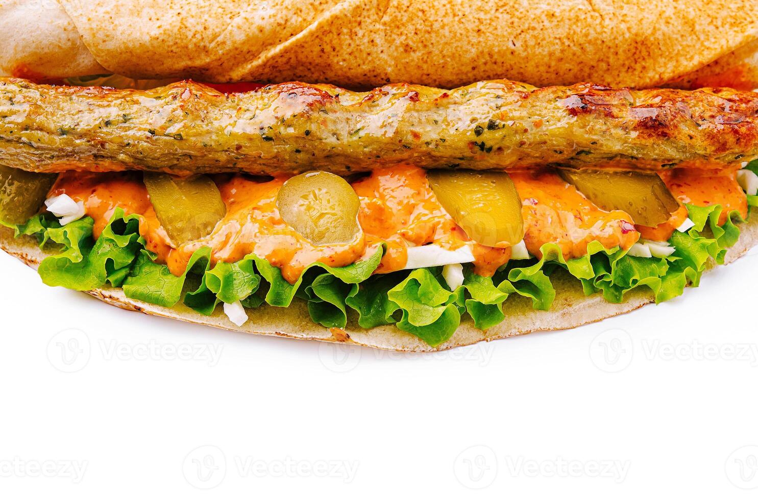 Freshly made sandwich with greens and grilled chicken sausage photo
