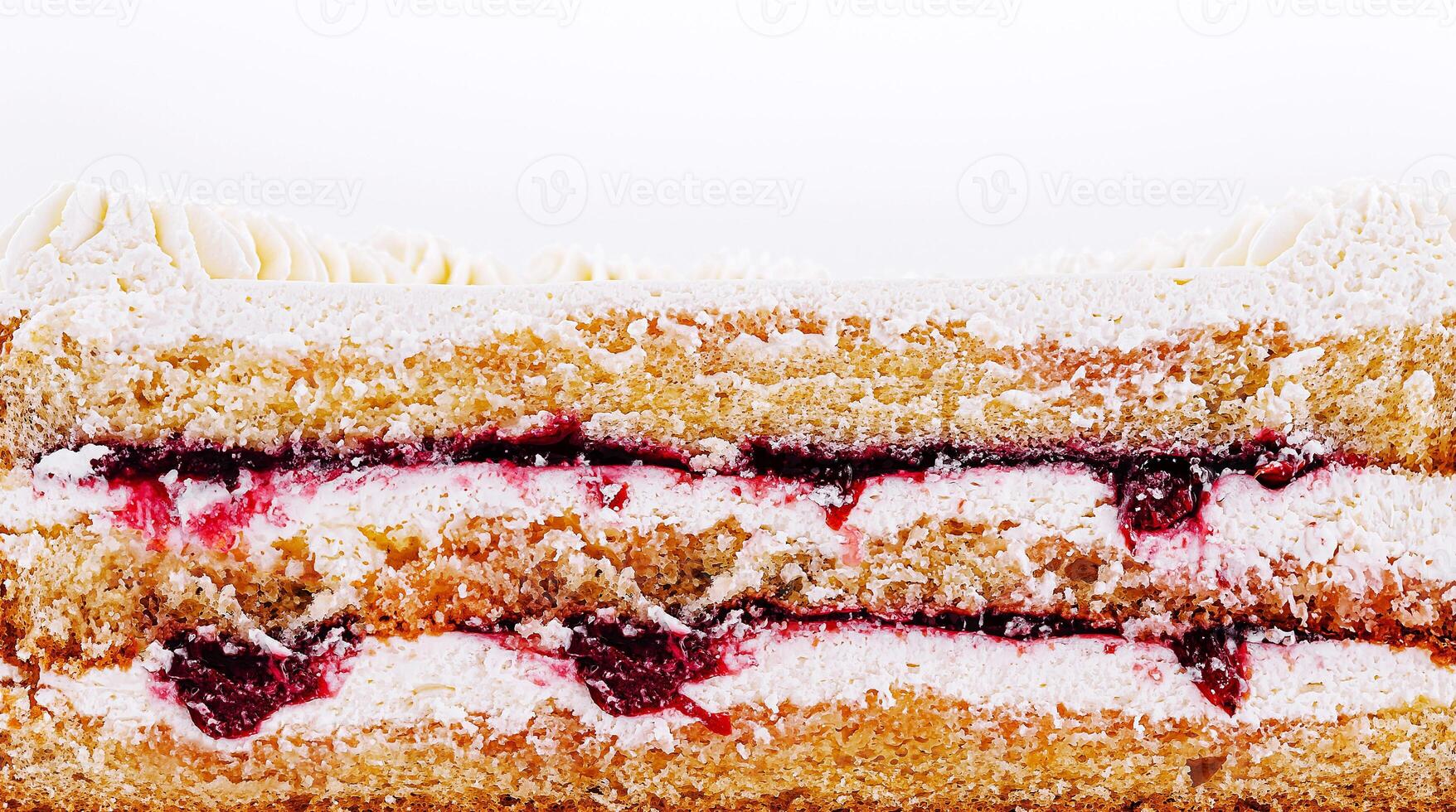 Creamy dessert layered with fruit jam in a bakery display photo