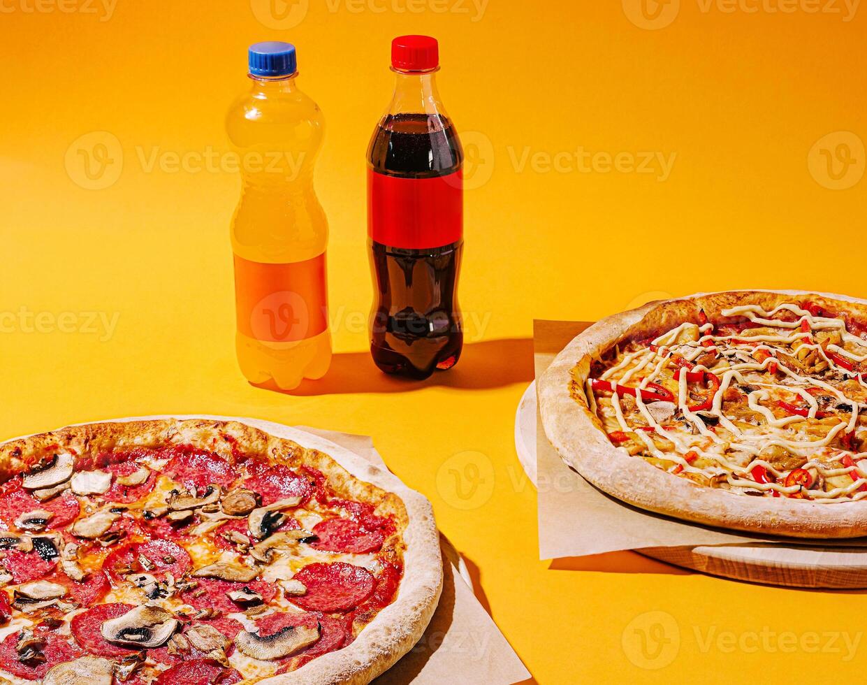 Enjoying delicious pizzas and refreshing drinks on a colorful backdrop photo