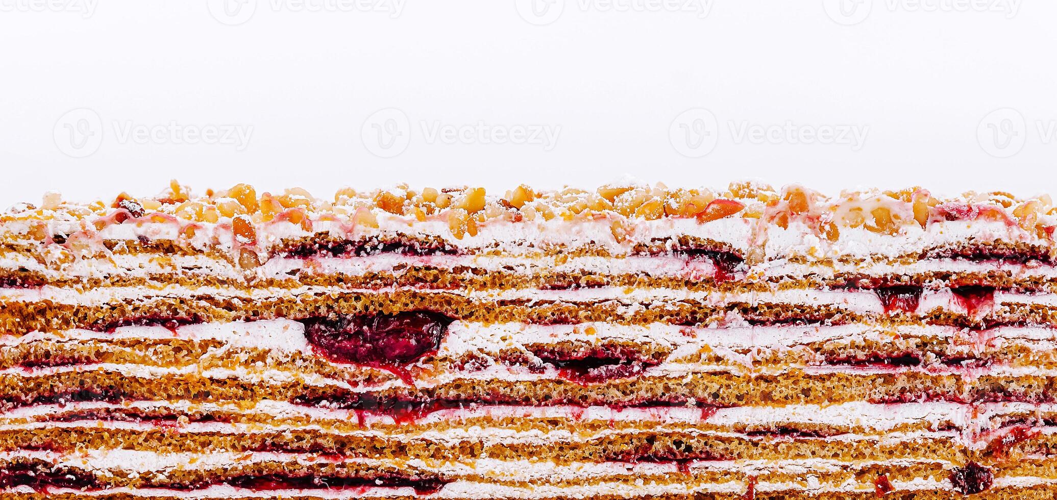 Decadent layered dessert crafted with sweet fruit filling and nuts photo