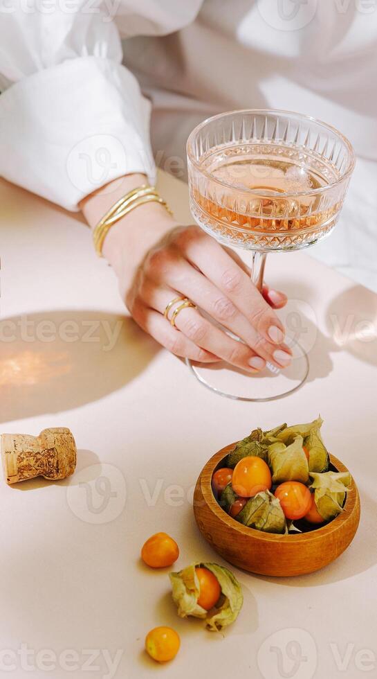 Elegant gathering with sparkling drink and fresh fruit on table photo