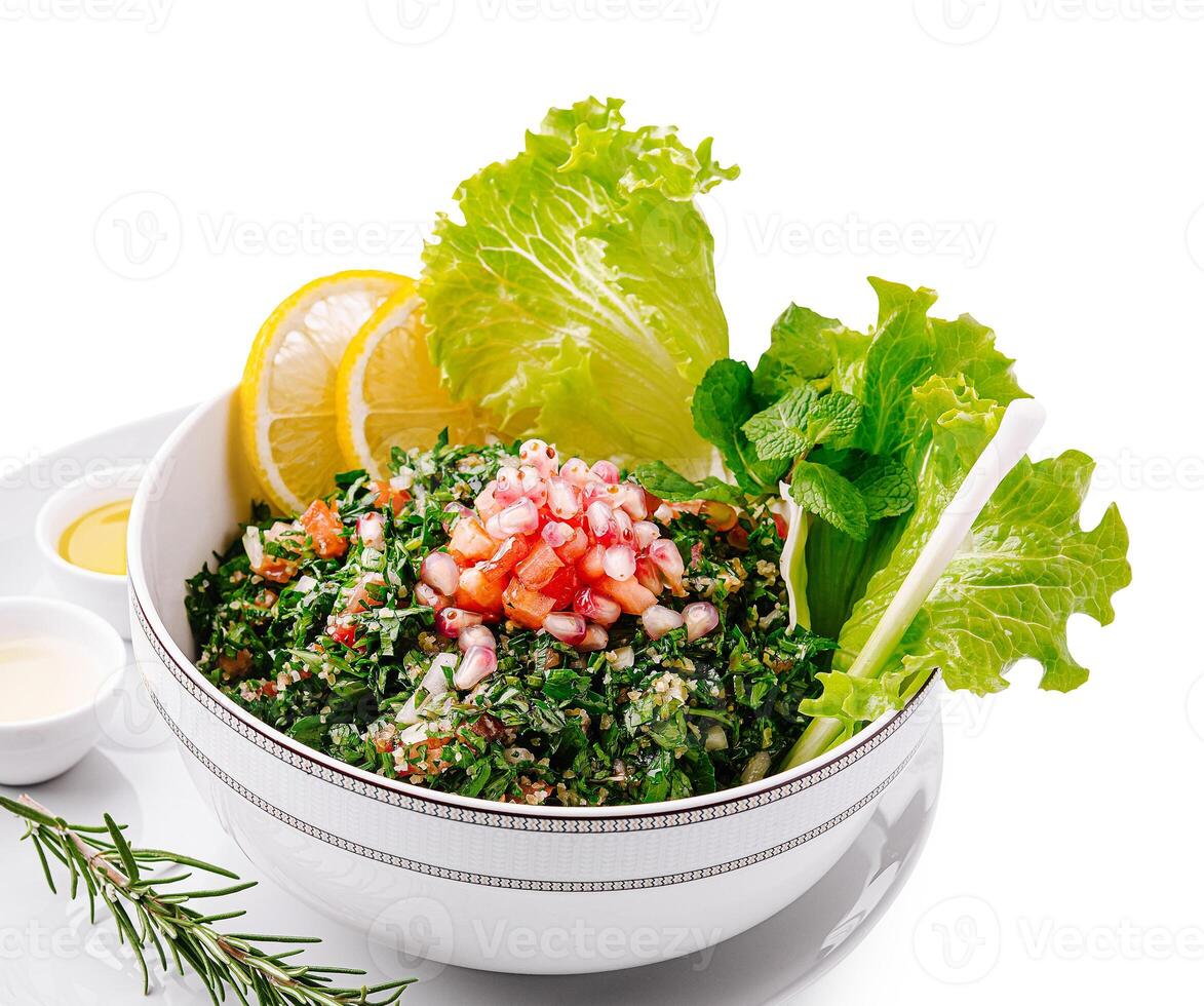 Fresh salad with herbs, greens, and citrus in a bowl photo