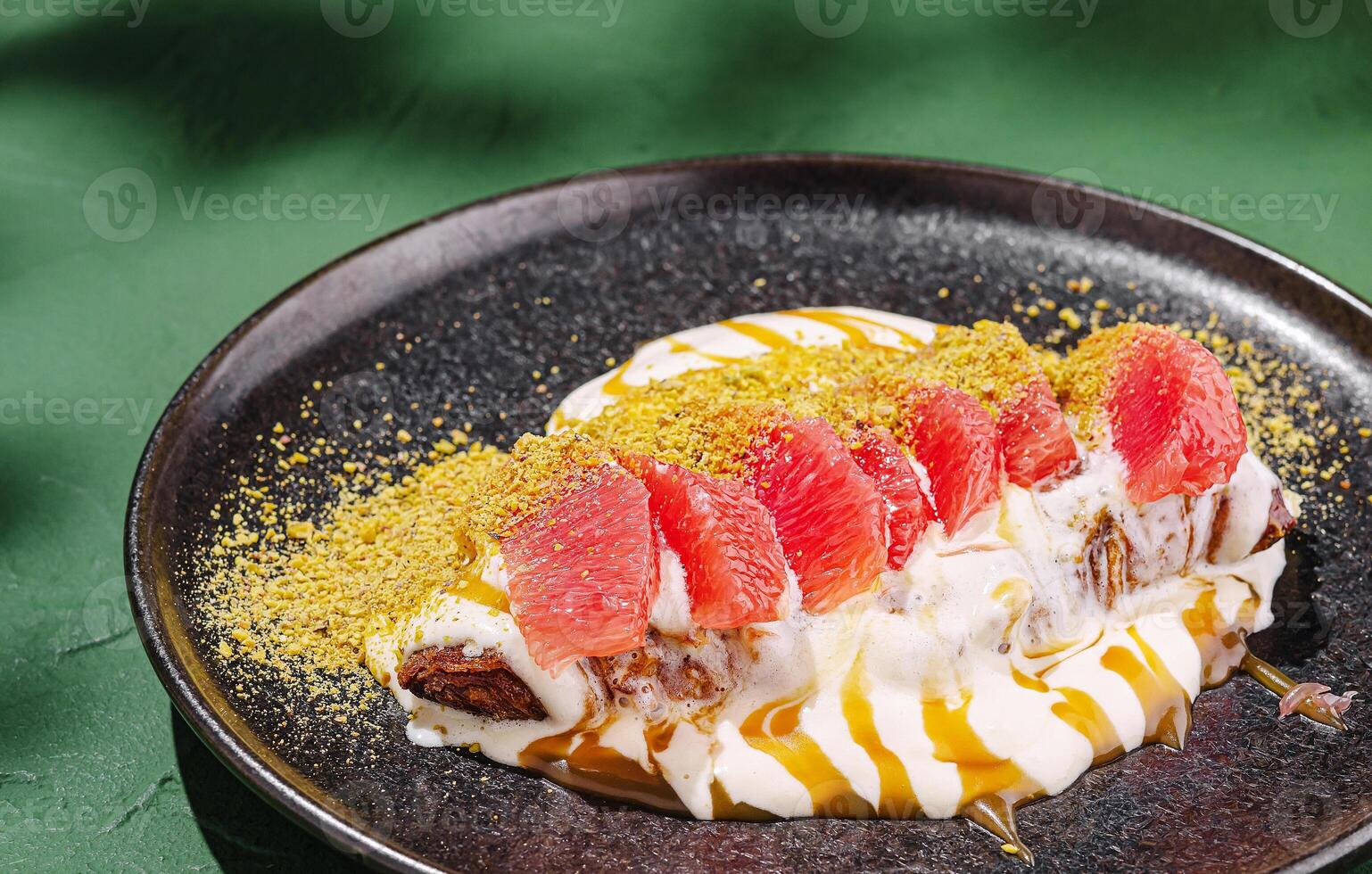 Delightful dessert with grapefruit and whipped cream served elegantly photo