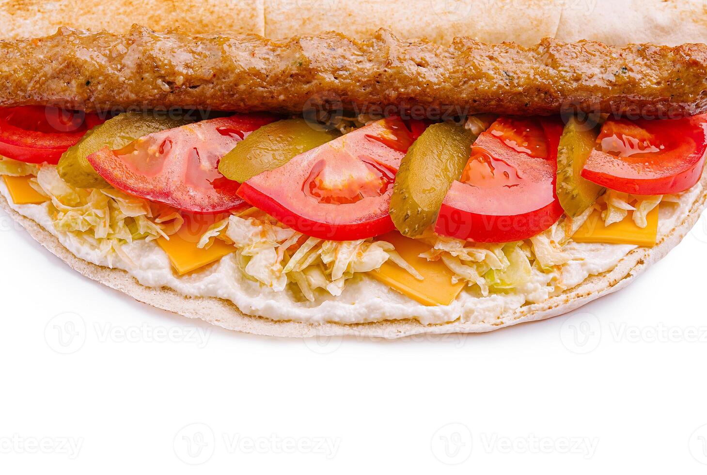 Delicious wrap filled with fresh ingredients and savory sauce photo