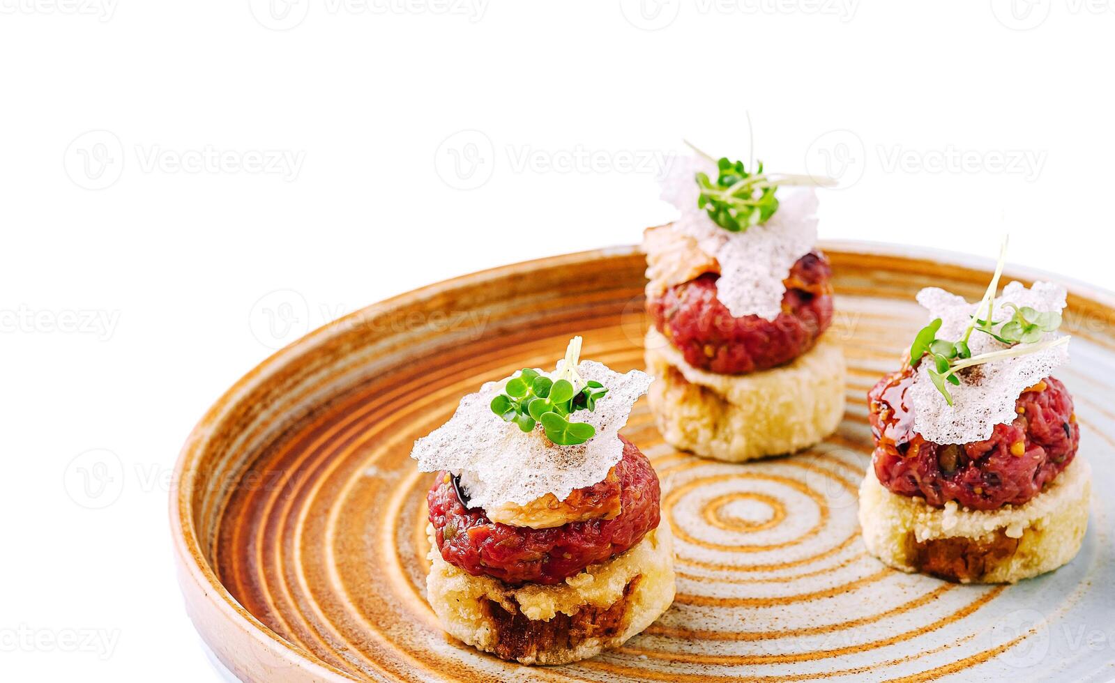 Gourmet dish served on a decorative plate at a fine dining restaurant photo