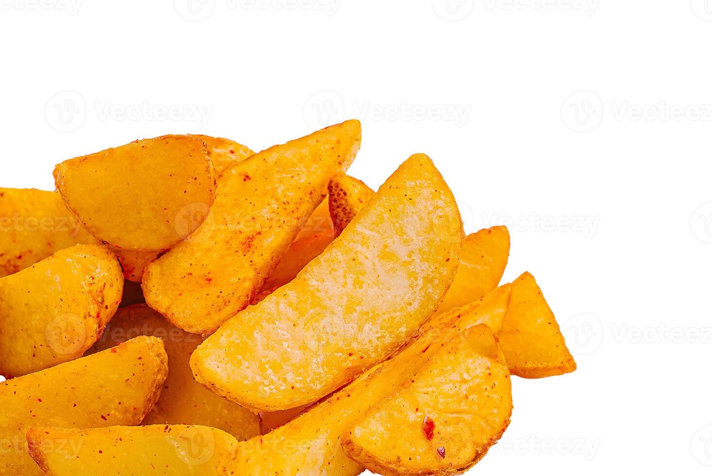 Crispy potato wedges prepared with spices on a white background photo