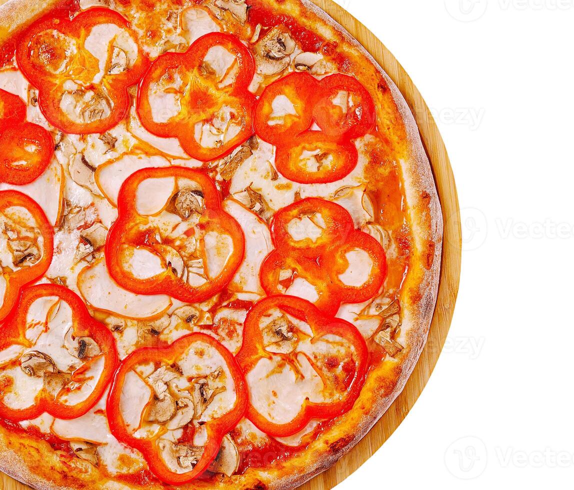Delicious pizza topped with red peppers and mushrooms photo