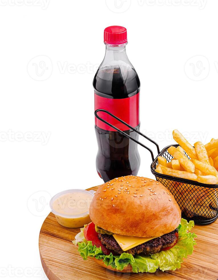 Delicious hamburger with fries and cola on a wooden platter photo