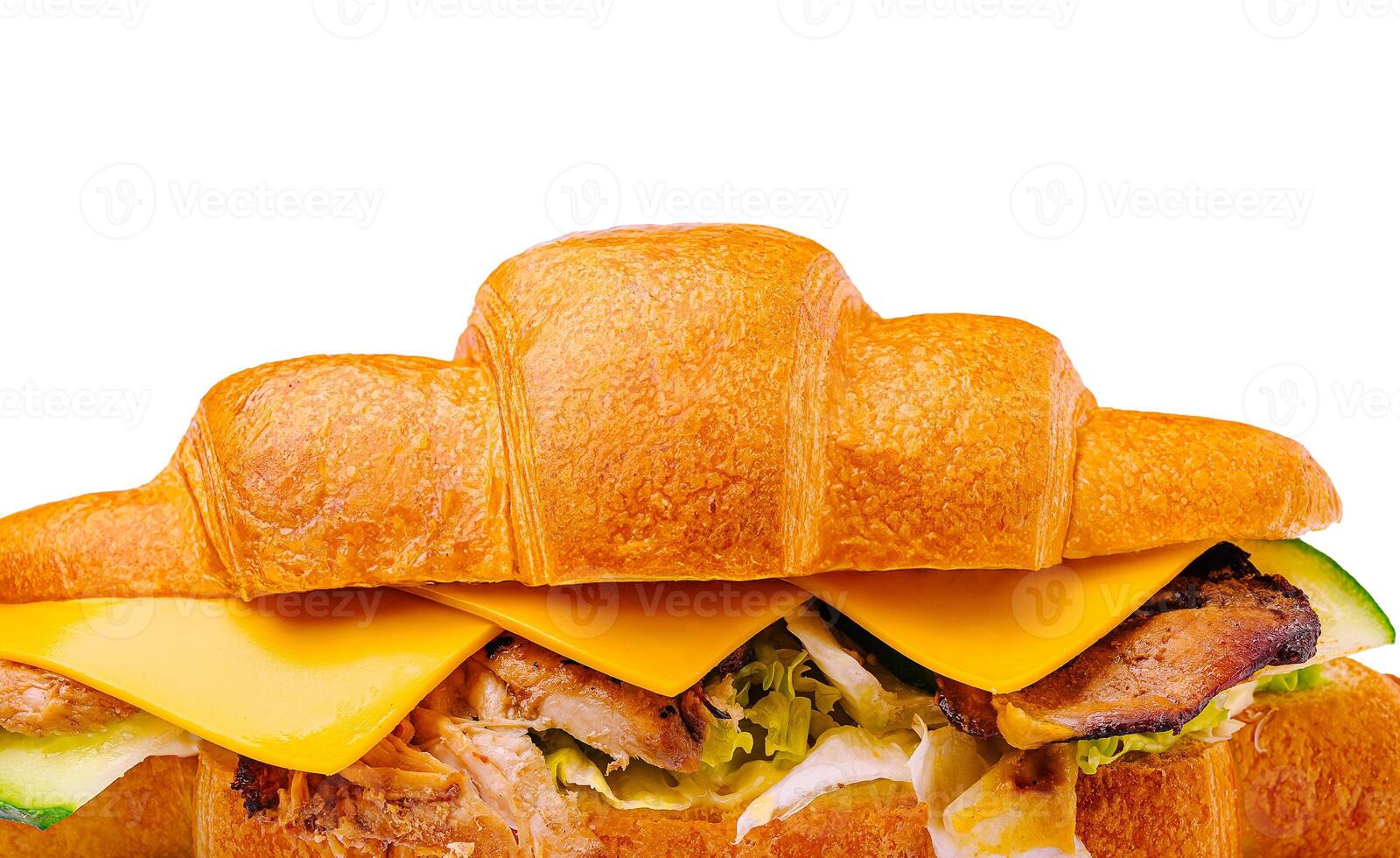 Delicious croissant sandwich filled with cheese and grilled chicken photo