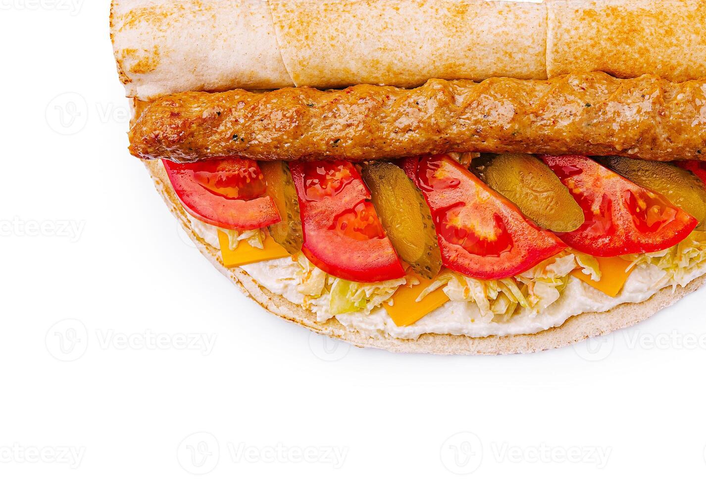 Delicious sandwich with meats, vegetables, and cheese on display photo