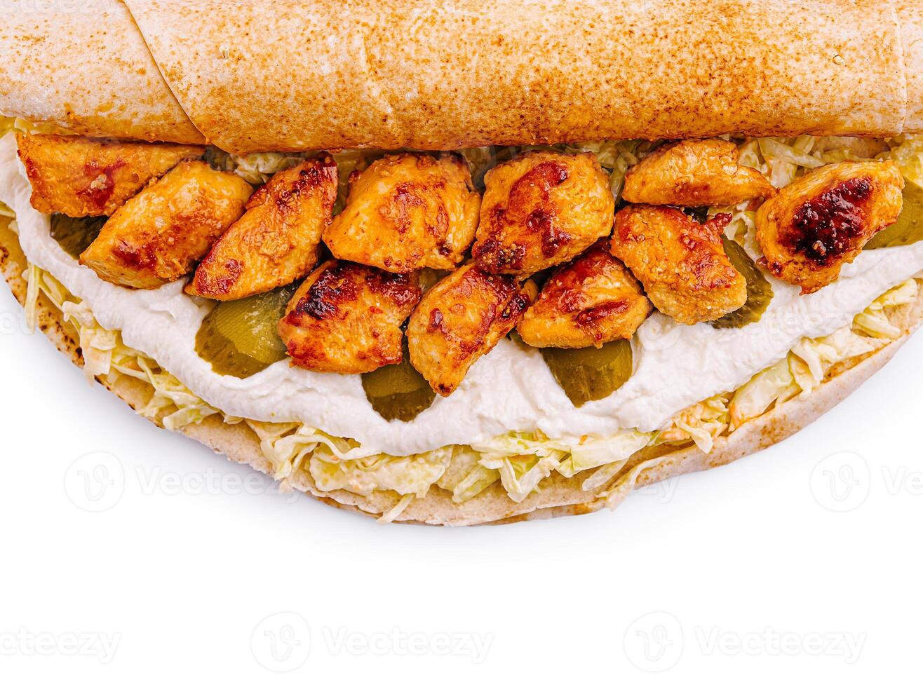 Grilled chicken wrap with fresh vegetables and sauce photo