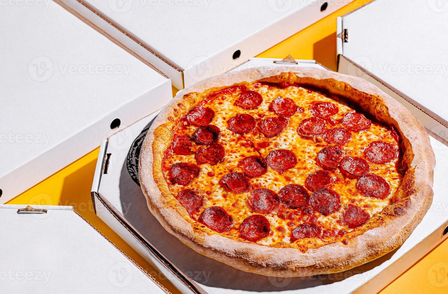 Delicious pepperoni pizza ready to share at lunchtime gathering photo