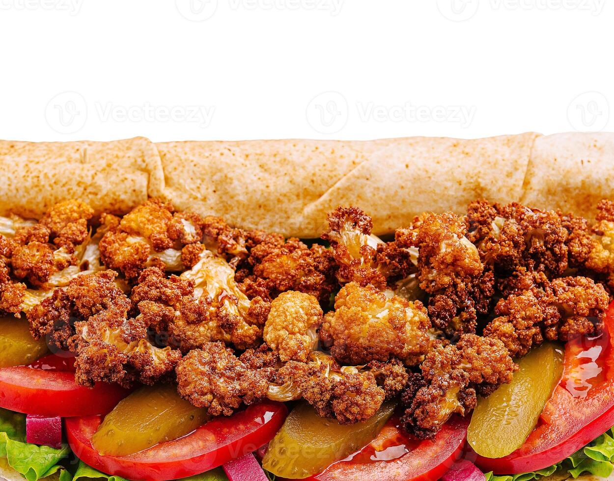 Crispy cauliflower wrap with fresh vegetables and toppings photo
