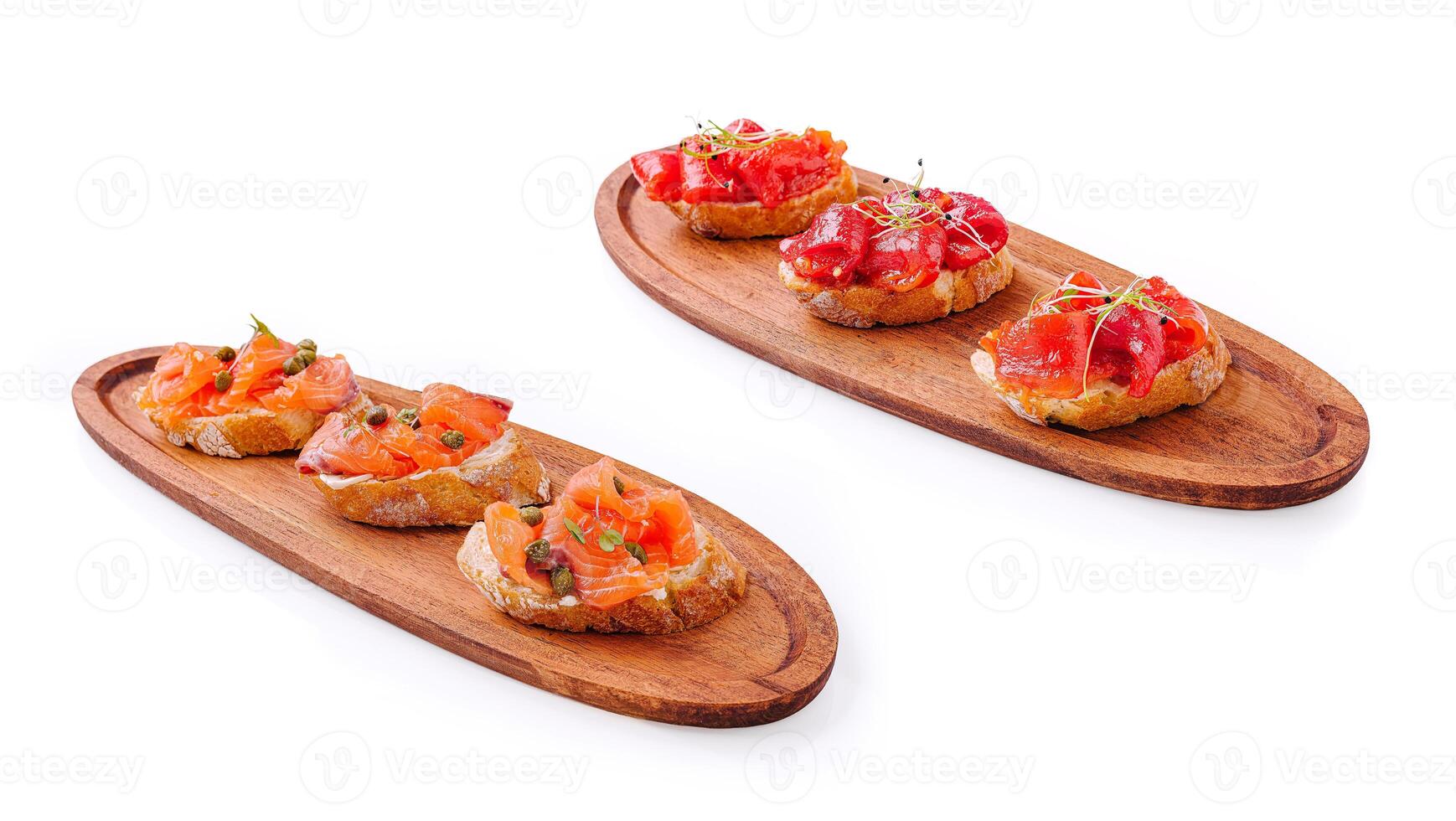 Gourmet tapas with smoked salmon and vibrant tomato toppings photo