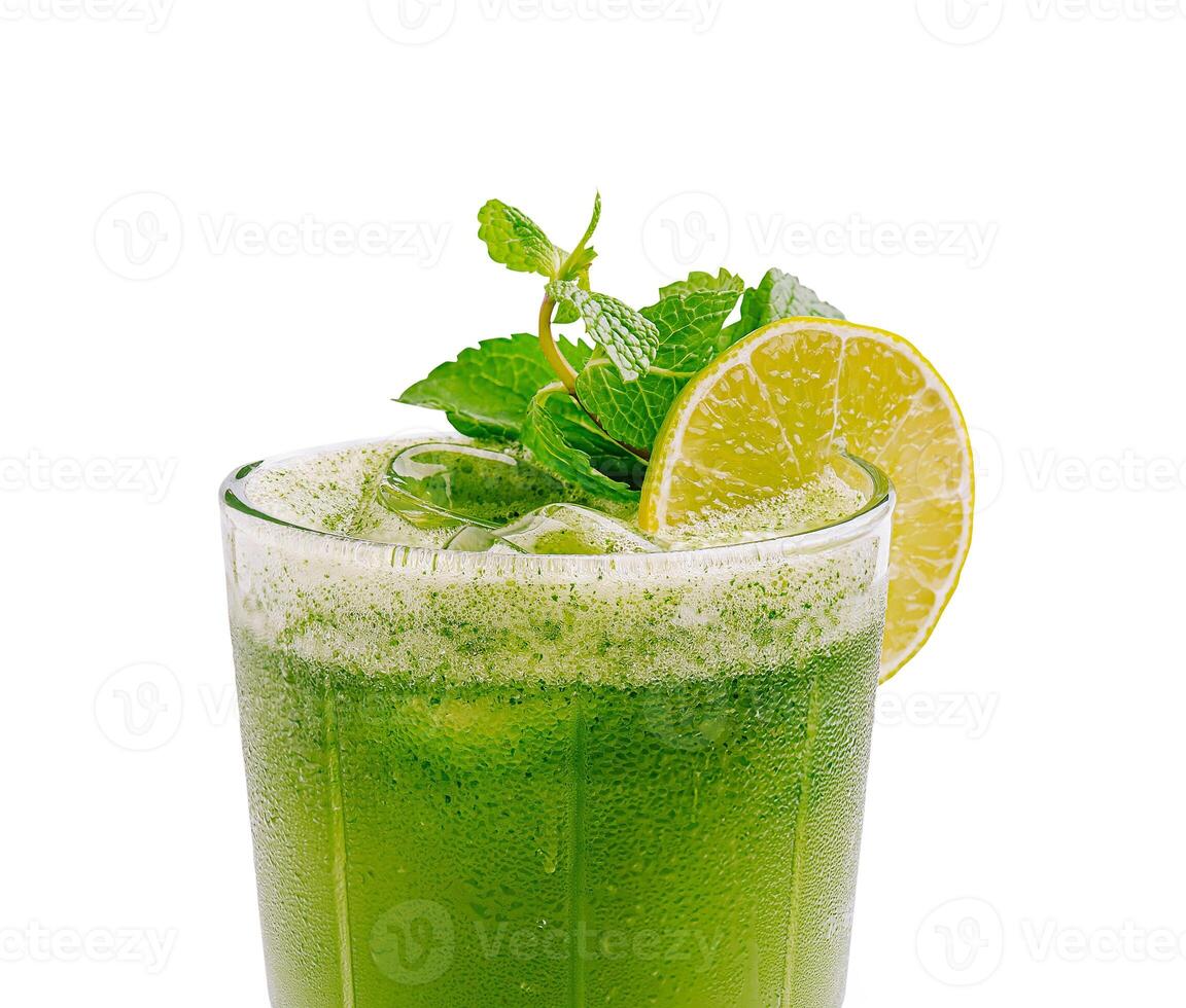 Refreshing green drink with mint and lime served in a glass photo