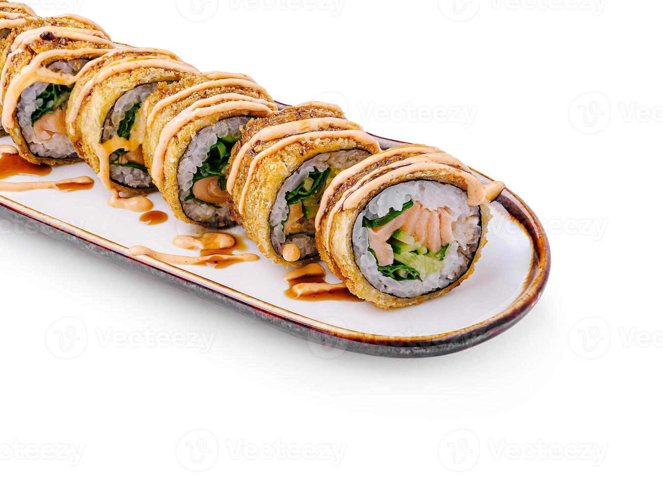 Unique fried sushi rolls presented on a decorative plate photo