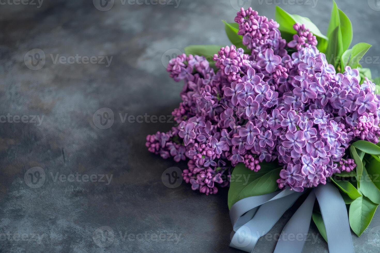 Elegant bouquet of purple lilacs on dark background photo
