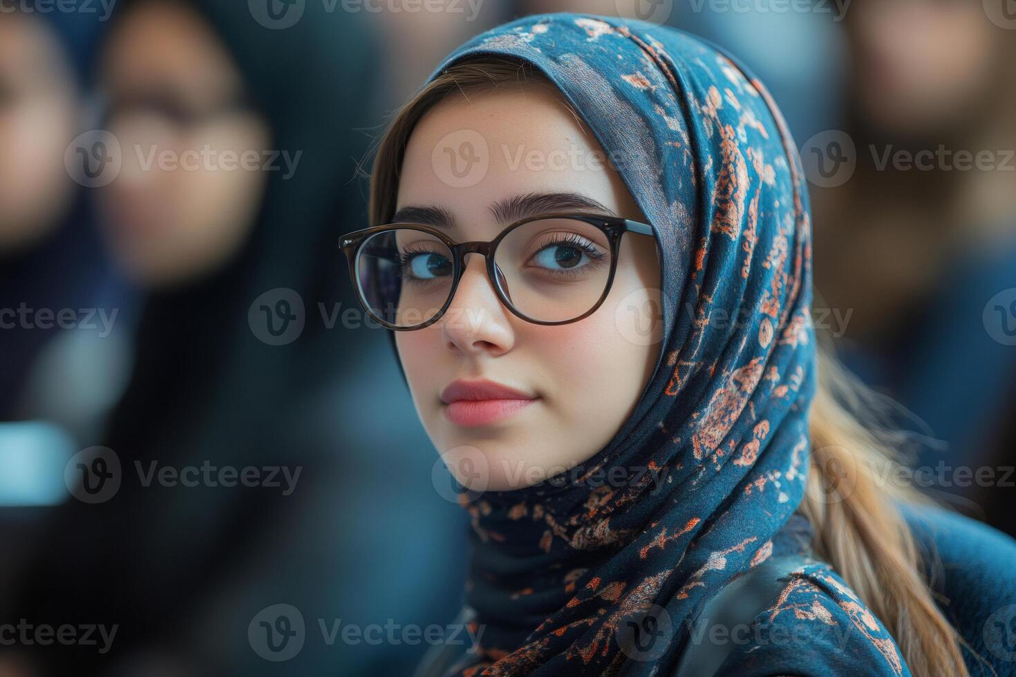 Young muslim woman wearing hijab and glasses in a modern setting photo