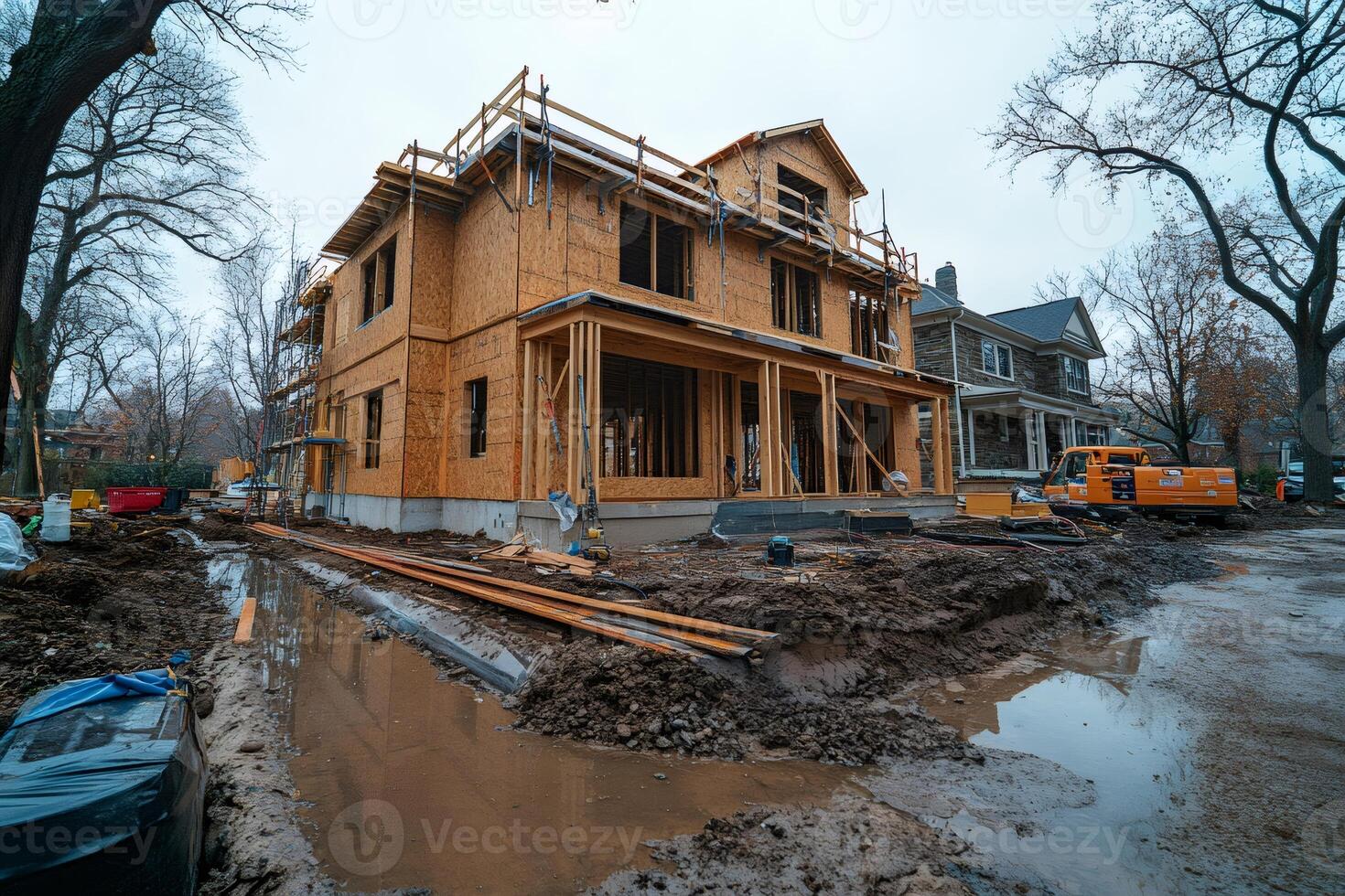 New residential house construction site showing plywood framing stage photo