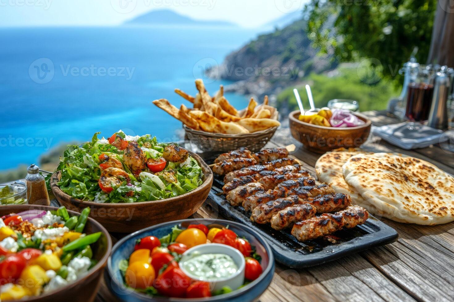 Delicious mediterranean food served on table overlooking beautiful coastline photo