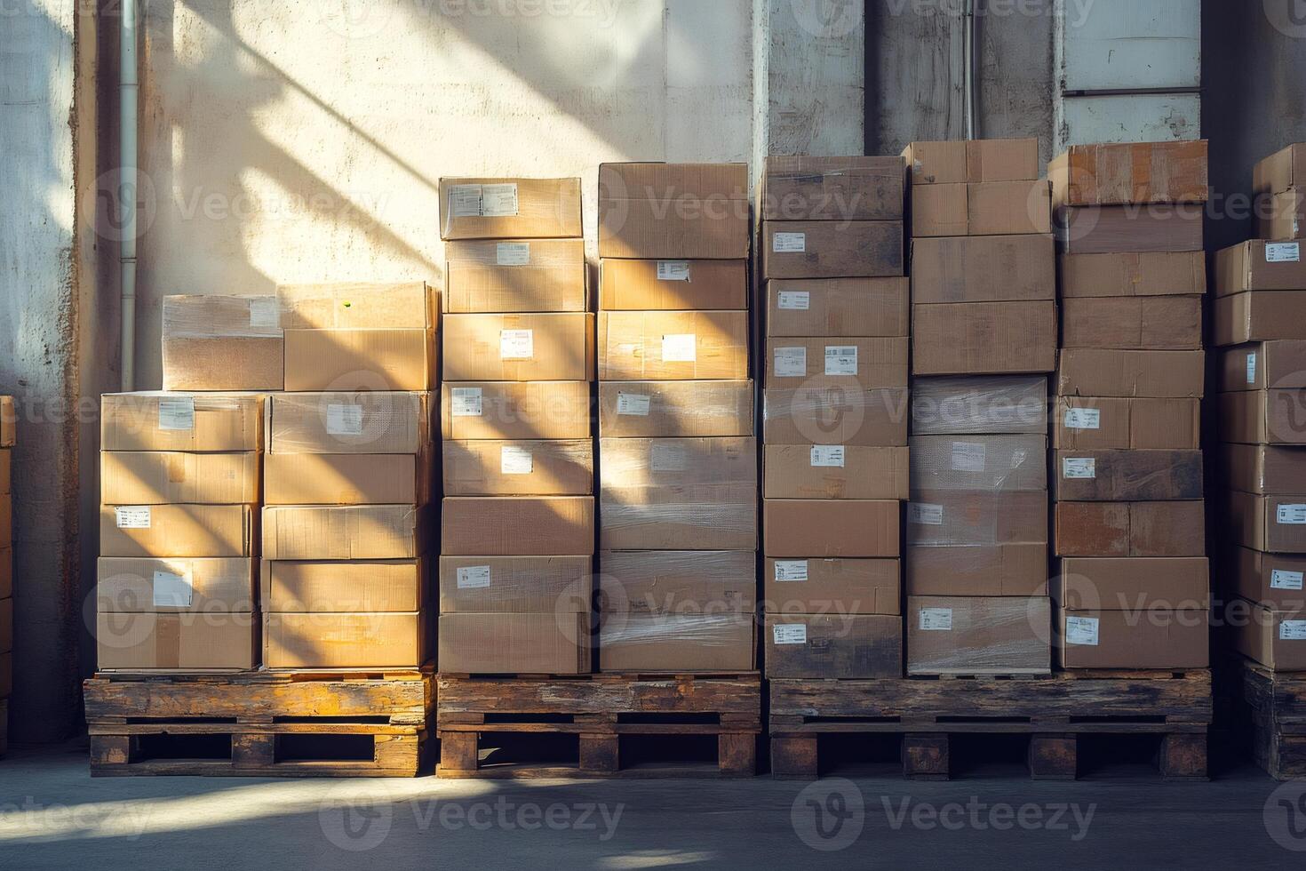 Stacked cardboard boxes on wooden pallets in warehouse photo