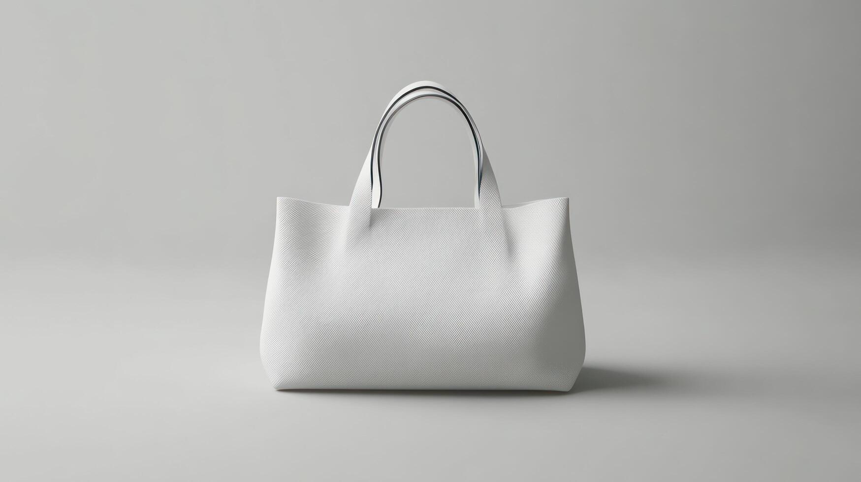 A white leather tote bag on a gray surface photo