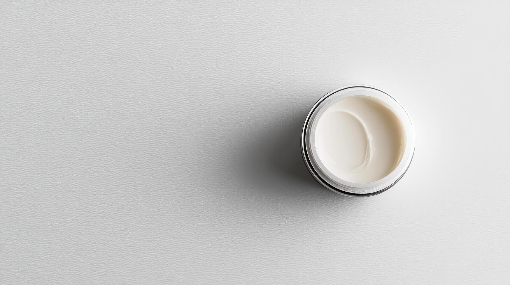 A white container with cream on top photo