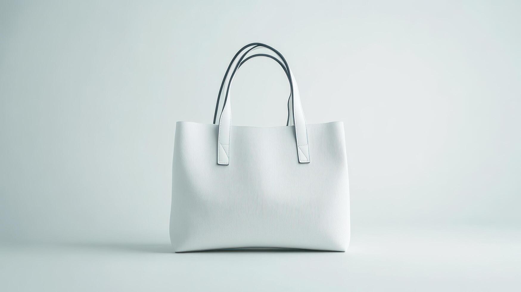 White leather tote bag on a gray background photo