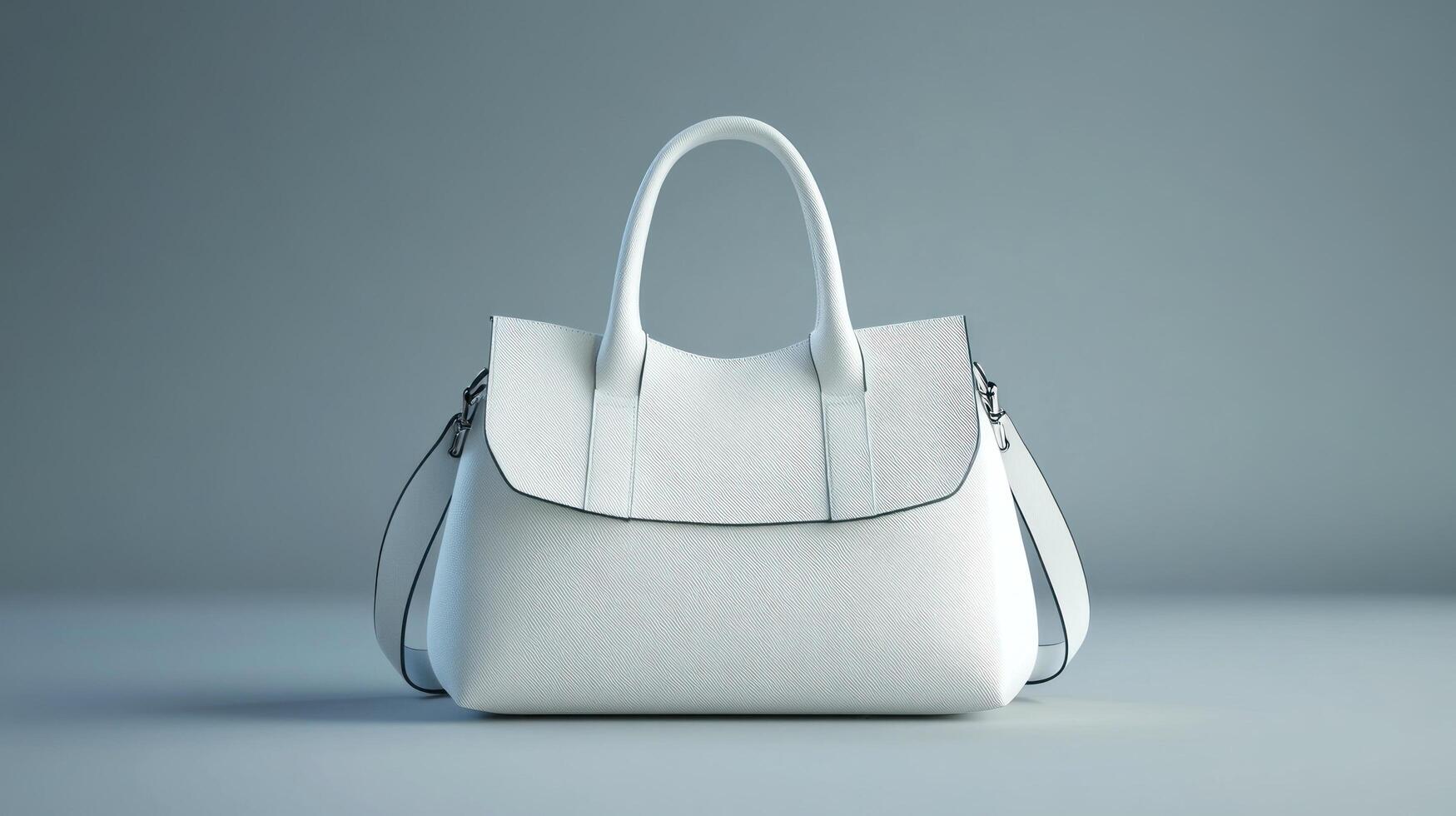 A white handbag on a gray surface photo