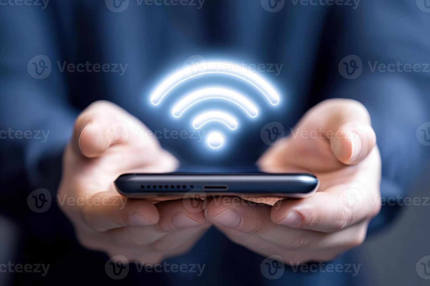 Person holds smartphone with holographic Wi-Fi symbol, illustrating modern wireless connectivity and sleek technology design photo