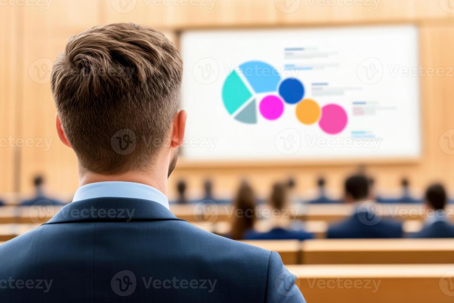 Business professionals engaged in a conference presentation with data visualization displayed on large screen in a modern conference room photo