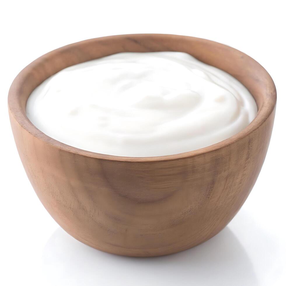 Yogurt in a wooden bowl on a white background photo