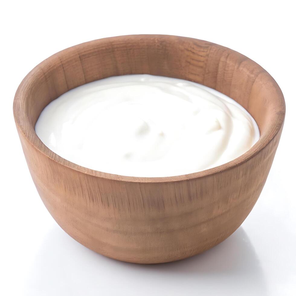 Yogurt in a wooden bowl on a white background photo