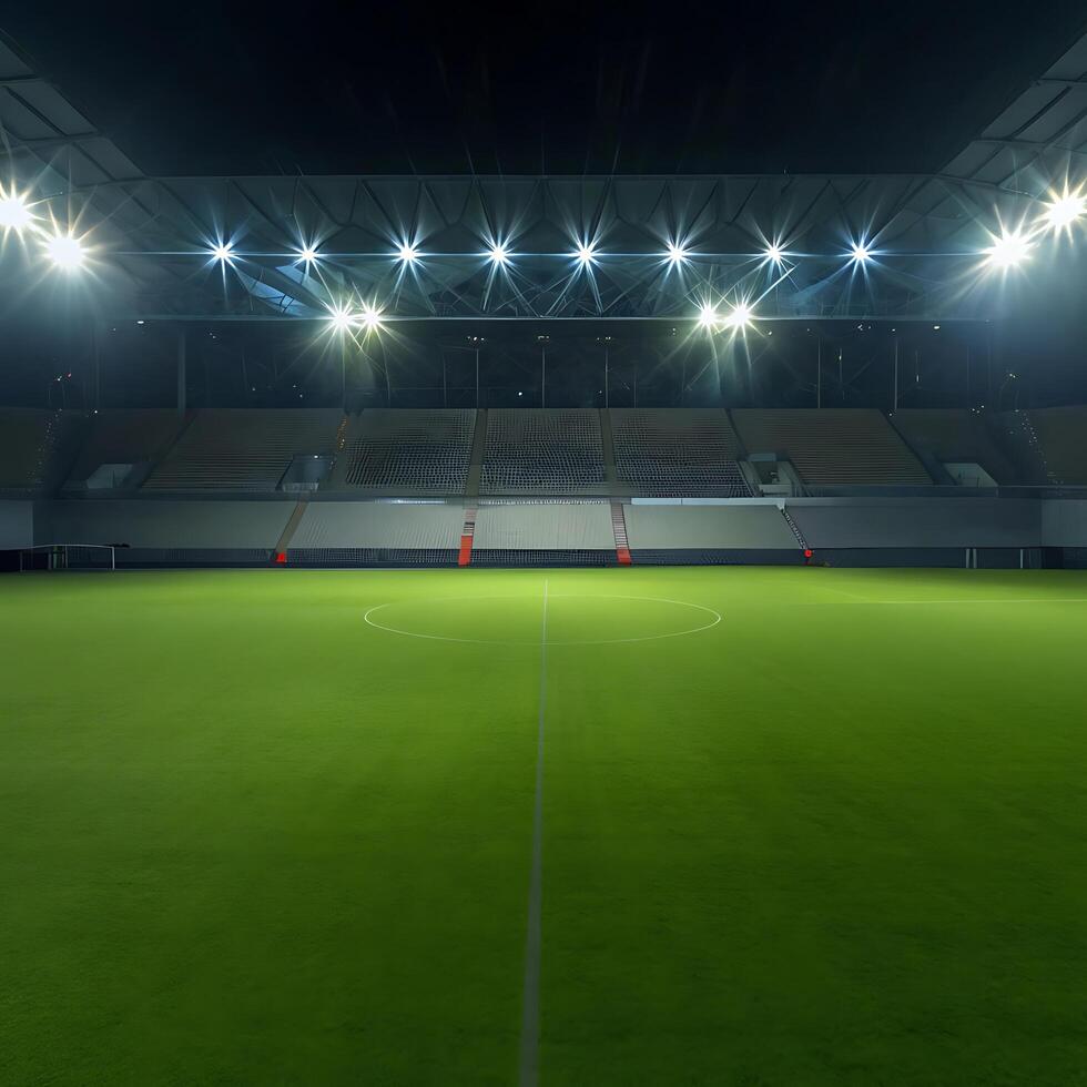 Night view of empty soccer stadium with bright stadium lights illuminating the green field and empty stands photo