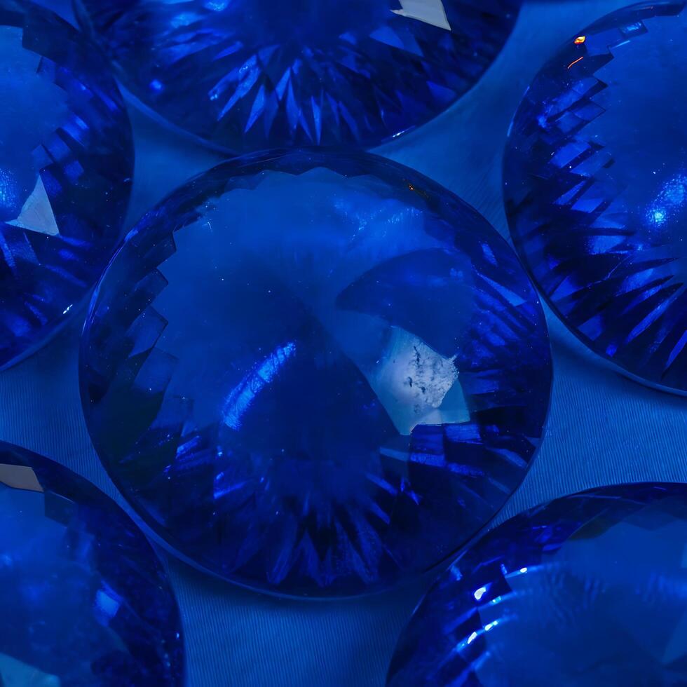 Closeup View of Sparkling Blue Gemstones Arranged on a Blue Background photo