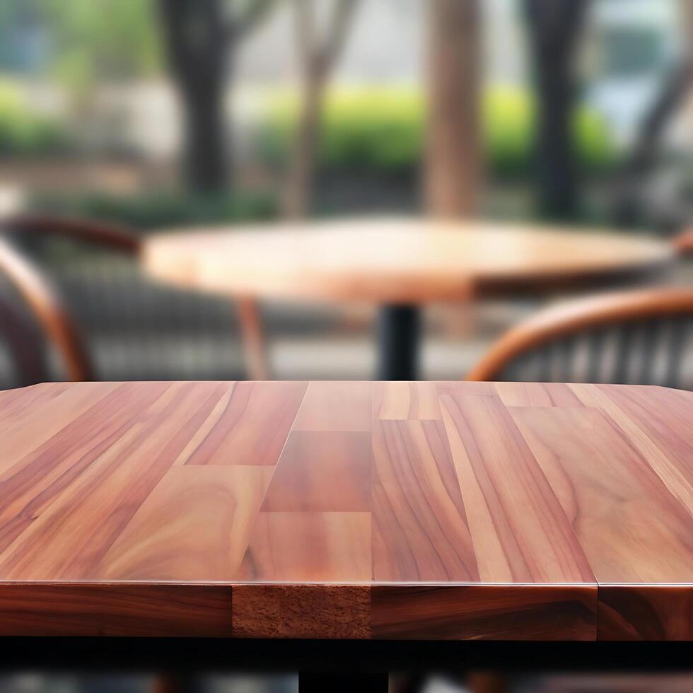 Empty Wooden Table in a Blurred Outdoor Cafe Setting photo