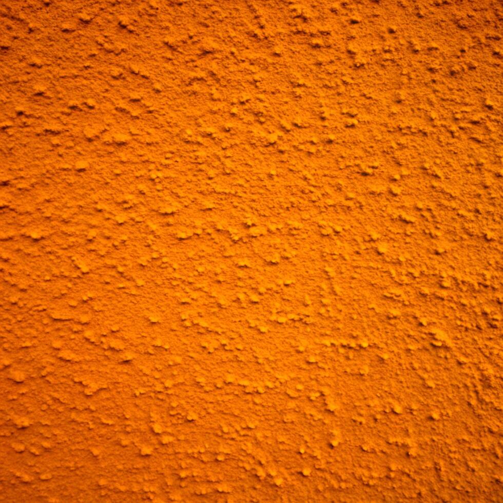 A Detailed Close Up View of a Bright Orange Textured Wall photo