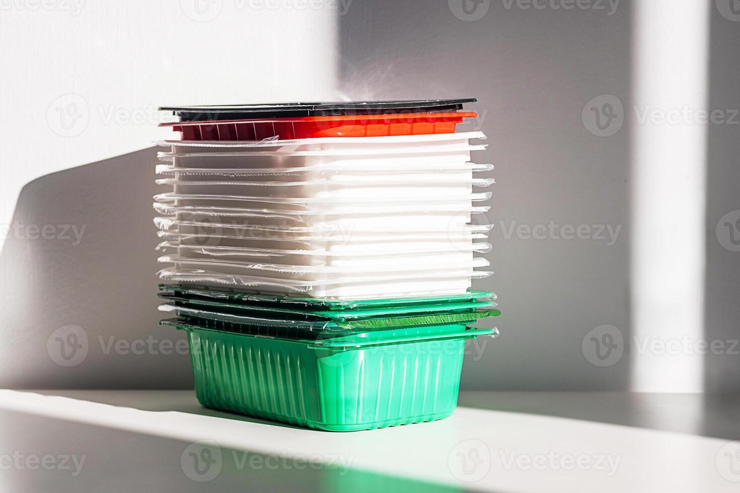 Pile of disposable plastic food containers ready for sorting photo