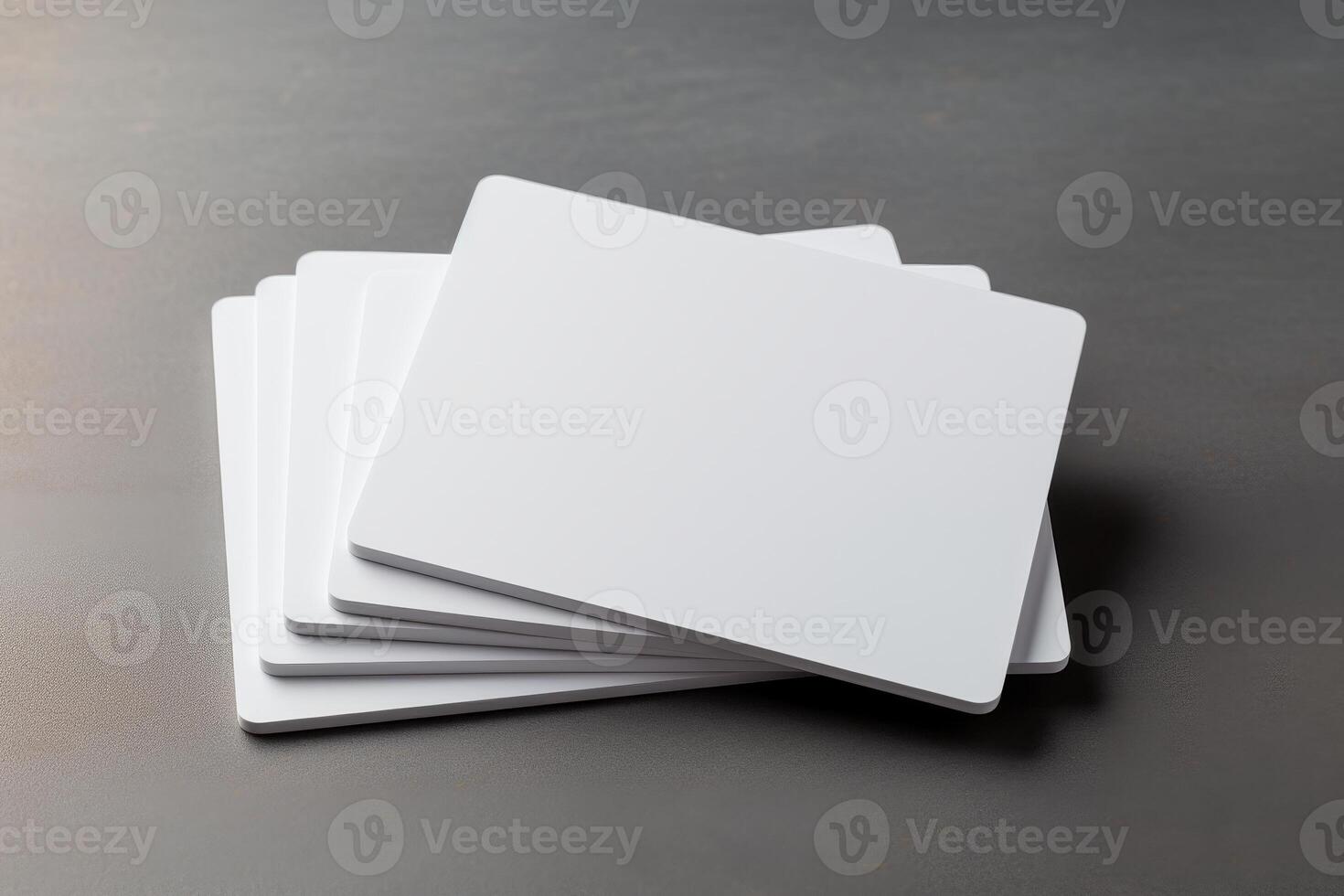 Stacked Collection of Five Blank White Credit Card Mockups for Design and Presentation Purposes on a Neutral Background photo