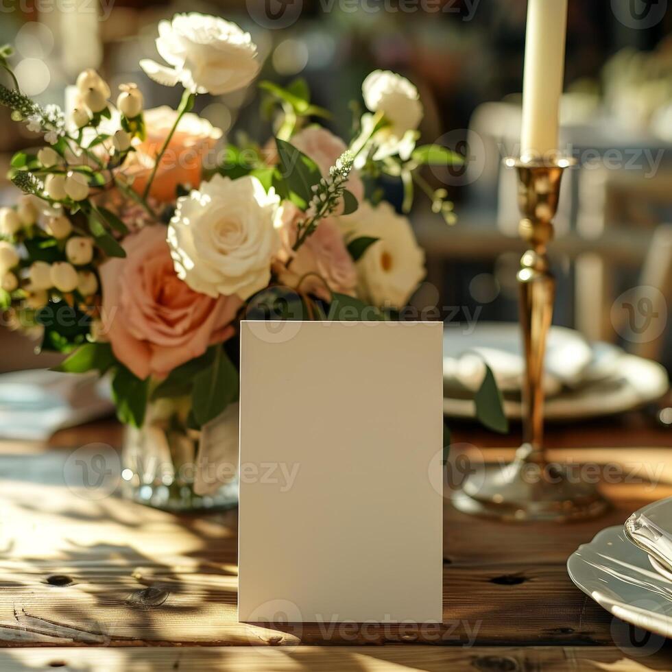Elegant Wedding Table Setting with White Folded Card on Rustic Table Surrounded by Beautiful Floral Arrangement and Candlelight for Distinctive Celebrations and Events photo