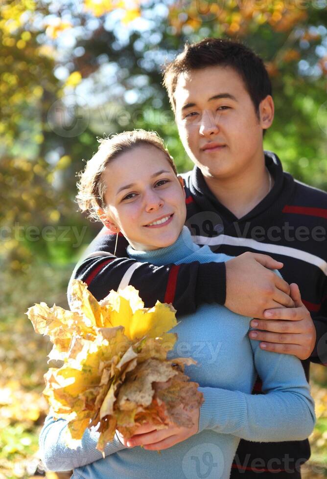 Happy young couple in love outdoors, autumn photo